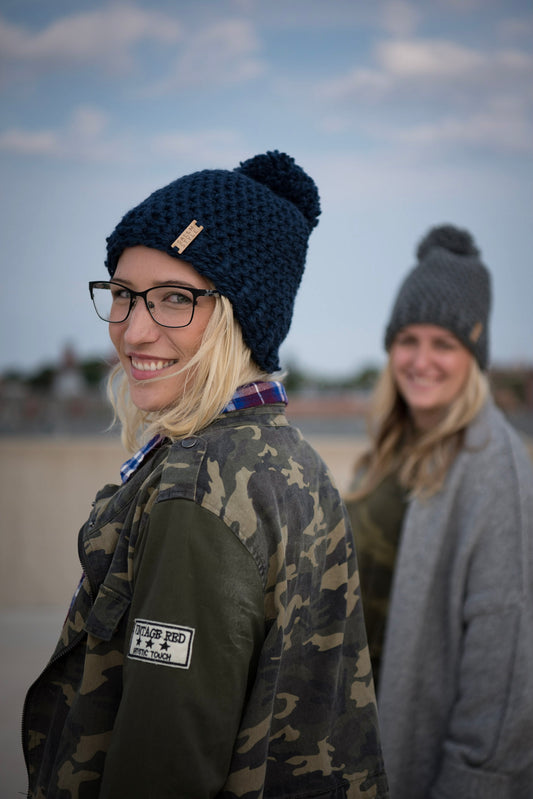 The Winter Island Pom Pom Hat in Navy Blue